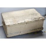 A cream-painted twin iron handle wooden storage box on plinth base, width 85cm (af).