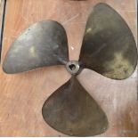 A large bronze triple bladed ship's propeller, diameter 62cm.