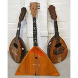 Two Italian mandolins, one signed Luigi D'amore Napoli and a balalaika (3).
