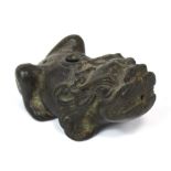 An early Chinese bronze water dropper modelled as a chi chi, probably 17th century, length 9cm.