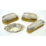 A set of three George V hallmarked silver-backed brushes,