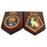 Two heavy cast iron plaques 'Obedient' and 'Saumarez' both on mahogany shield-shaped plinths,