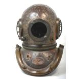 A rare original Siebe Gorman copper six bolt diver's helmet bearing original oval plaque,