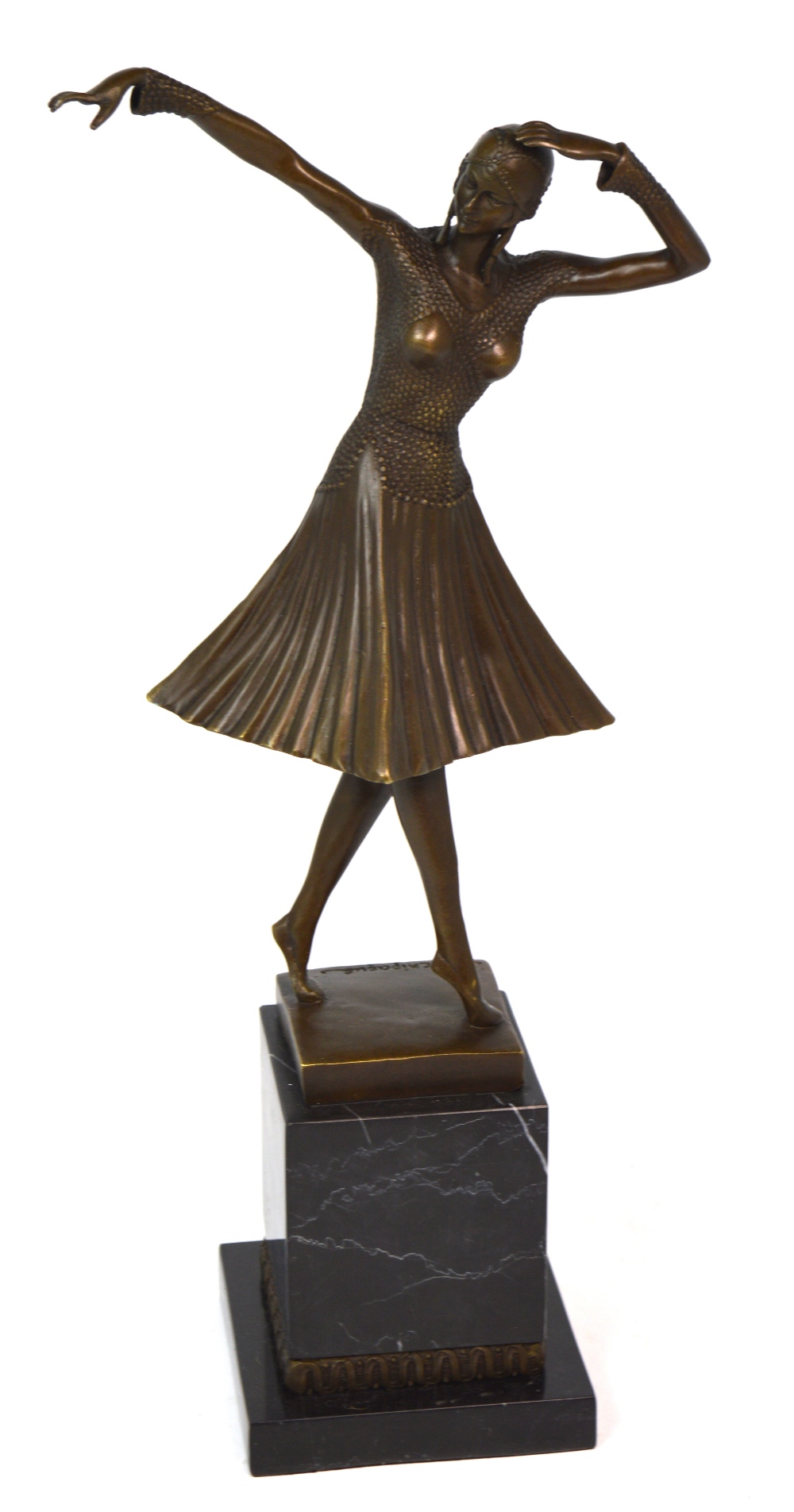 An Art Deco style hot cast bronze, a female dancer on a marble plinth, signed D.H.