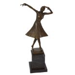 An Art Deco style hot cast bronze, a female dancer on a marble plinth, signed D.H.