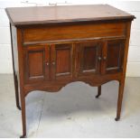 An Edwardian mahogany cased wind up gramophone on tapering legs (af), length 87cm,