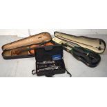 Two cased violins, a cased Lindo clarinet and a Axel harmonica (4).