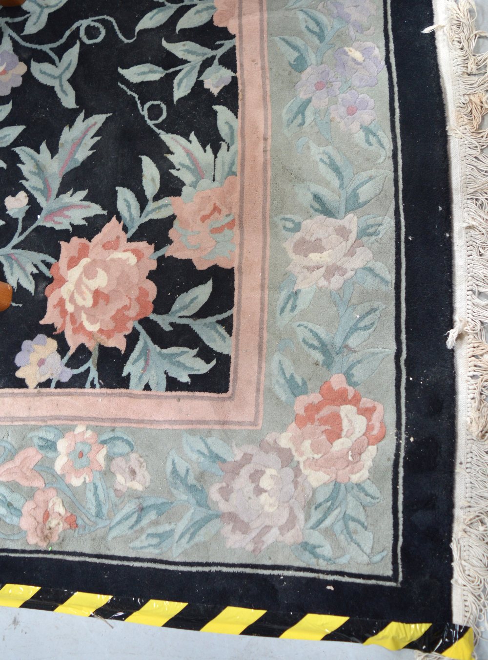 A large black ground floral decorated Chinese Superwash carpet, 390 x 275cm.