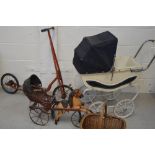 A vintage white-painted pram, a novelty child's horse and cart,