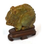 A Chinese carved jade model of a chi chi,