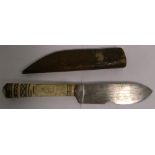 An early 20th century scrimshaw whaling knife with brass mounted scabbard,