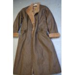 A c.1970s leather and sheepskin lined lady's full length coat.