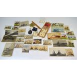 A maritime collector's lot comprising postcards, cigarette cards, whale teeth etc.