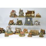 Approximately seventeen models of houses, cottages and buildings to include Lilliput Lane,