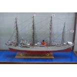 A Nipponmaru 1/100 scale model of a four masted vessel, in glazed case, length of case 115cm.