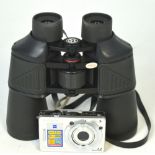 A Canon camera and a cased set of binoculars (2).