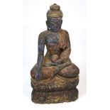 A 19th century Chinese carved wooden figure of Guan Yin modelled holding a bowl,