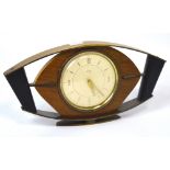 A retro mid 20th century Smiths mantel timepiece, dial set with gilt Arabic numerals and batons.