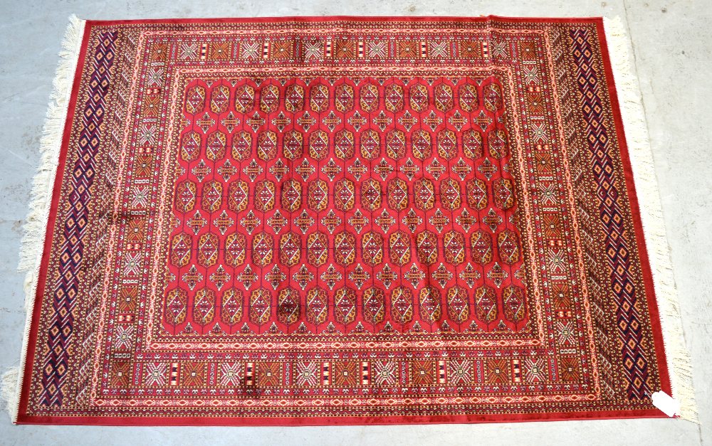 A red ground Bokhara style rug, 190 x 140cm.