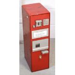 A 20th century red-painted stamp dispensing machine, height 60cm.