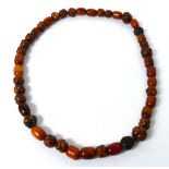 An unusual Chinese amber necklace,