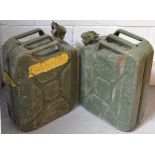 A pair of army green gas/oil canisters (2).