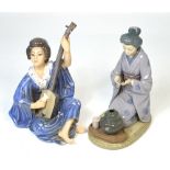 A Lladró figure of a kneeling geisha girl holding a tea bowl,