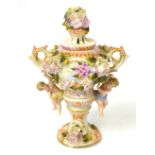 A continental vase in the style of Meissen decorated with roses and cherubs,