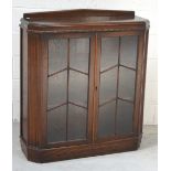 A c1940s oak astragal glazed display cabinet, width 92cm.