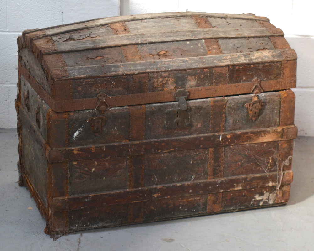 An early 20th century wooden domed strap-bound trunk, width approx 78cm.