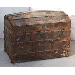 An early 20th century wooden domed strap-bound trunk, width approx 78cm.