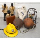 A collector's lot comprising a fireman's helmet, a pair of anchor Cornish made buoys,