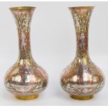 A pair of Eastern Cairoware brass bottle vases with flared rims,