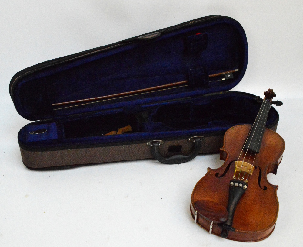 A three quarter sized German violin with two-piece back, labelled "Lowendall, Berlin",