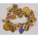 A 9ct yellow gold curb link charm bracelet with heart shaped padlock,