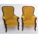 A pair of Victorian mahogany spoon back chairs, each shaped top rail with button upholstered back,