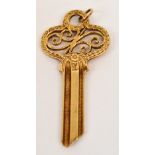 A 9ct gold key, approx 7.6g, cased.