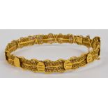 A 22ct yellow gold mesh bangle, with safety chain, oval 6.5 x 6cm, approx 20.4g.