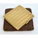 A 9ct yellow gold cigarette case of rectangular form with overall engine turned decoration,