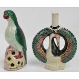 A 19th century Eastern porcelain bottle modelled as a bird with spread wings, height 22cm (af),