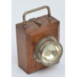 A wooden hand and bicycle front light with swing loop handle and sliding back plate,