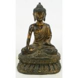 An 18th/19th century Chinese bronze figure of a seated Buddha on inverted shaped plinth and bearing