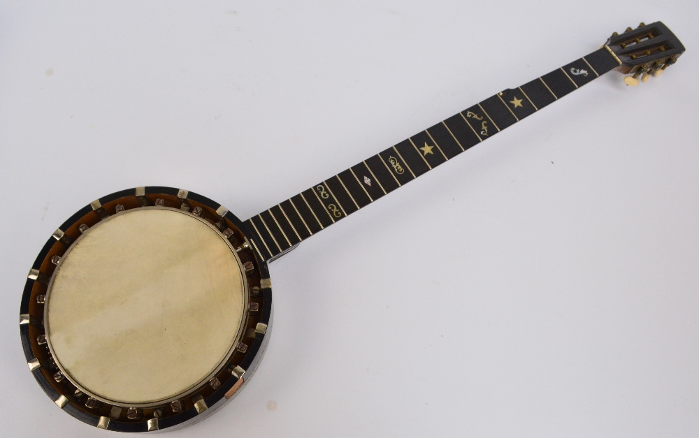 An early 20th century banjo by J.E. Dallas, 415 The Strand, London, no.3063, cased.