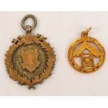 A 9ct yellow gold circular Masonic fob and a silver and silver gilt fob decorated with thistles,