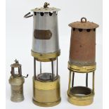 A brass and aluminium safety lamp by Naylor of Wigan, plus sections from two further lamps (3).