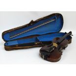 A full sized German violin with two-piece back, length 36cm, with repair label to interior for L.T.