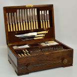 A 1930s oak cased canteen of cutlery and flatware for eight/nine settings,