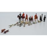 A playworn diecast Britain's hunting set comprising two riders on horses, two riders on ponies,