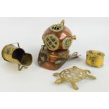 A copper and brass miniature diver's helmet, an oval brass box, a teapot stand modelled as a turtle,