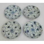 Tek-Sing cargo; four Chinese porcelain painted in underglaze blue,